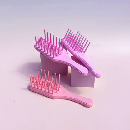 Cepillo desenredante de dientes anchos